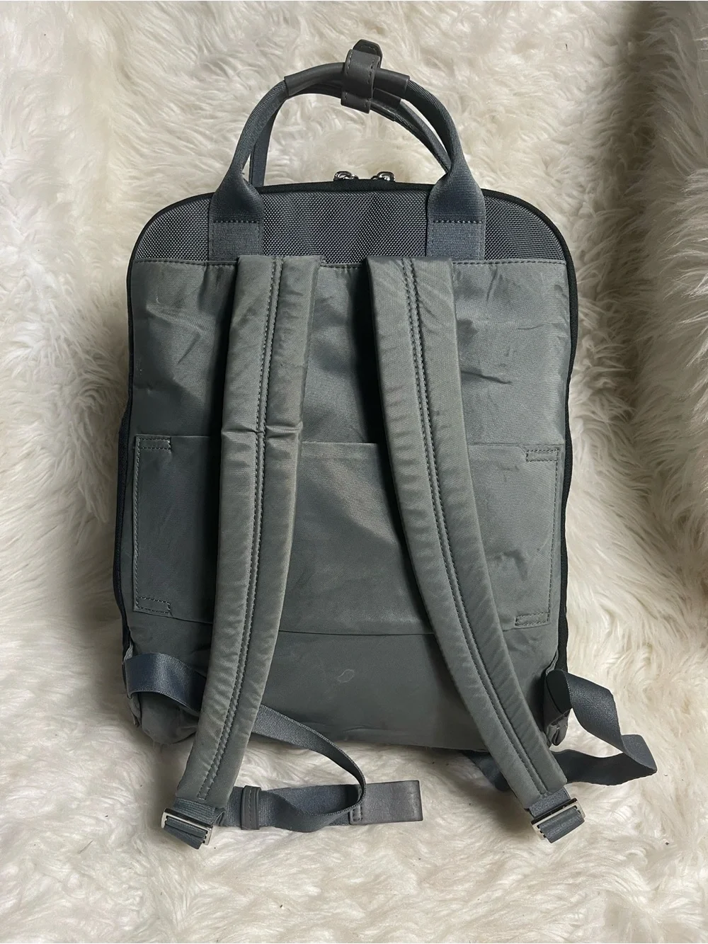 Tumi Voyageur Halsey nylon Gray Backpack with leather Top Handles.